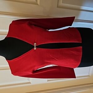 New without tags, beautiful sweater with jeweled closure.